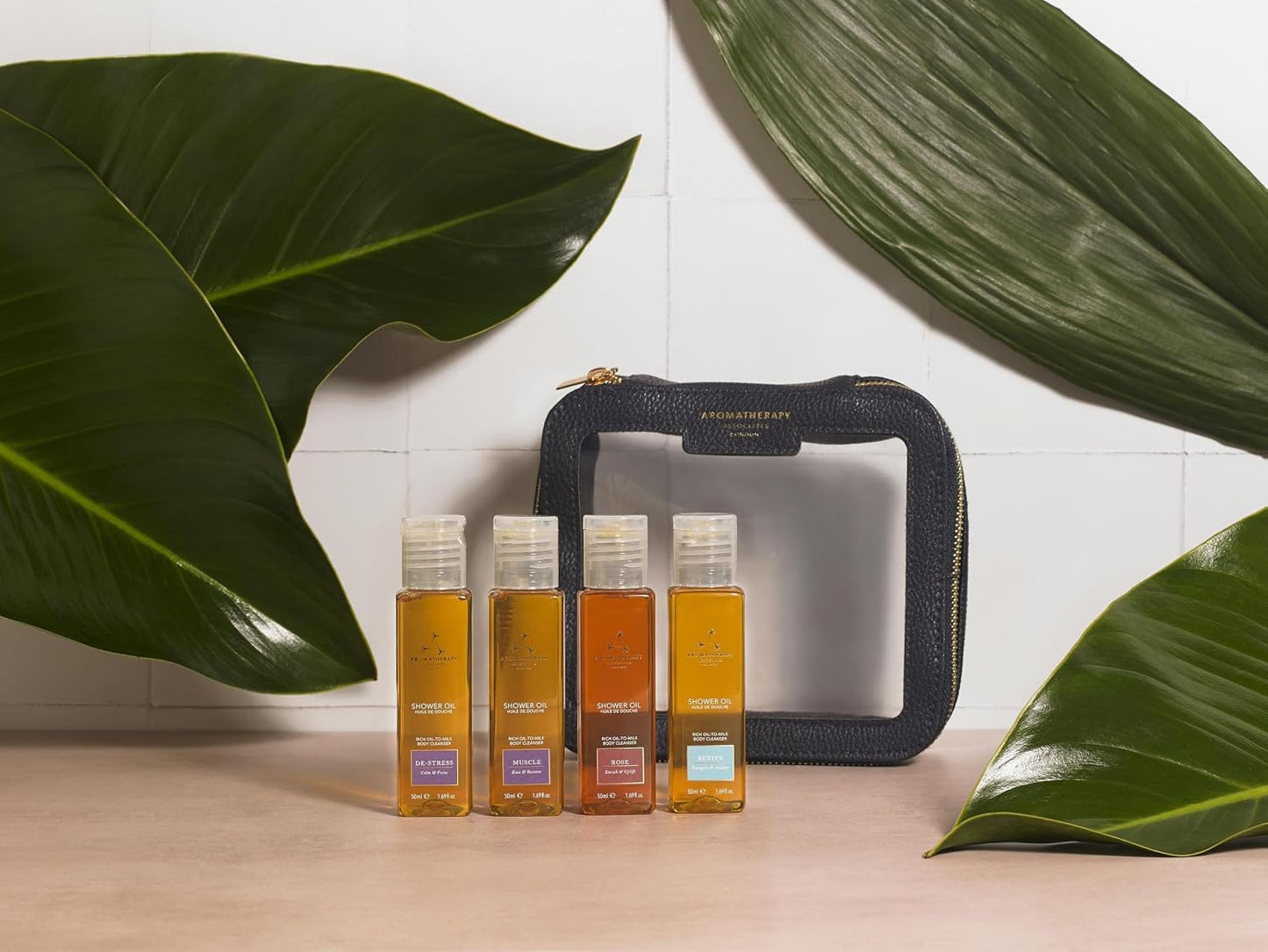Aromatherapy Associates Shower Oil Collection - Essential Oil for Cleansing - Made of Natural Oil Blends - Aromatic Oils to Awaken Your Senses - Luxurious Oil-to-Milk Formula, 4 x 50ml